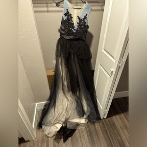 Tulle fabric, black, blue and white dress with zipper closure.